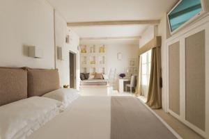 Ein Bett oder Betten in einem Zimmer der Unterkunft Baglioni Masseria Muzza Resort & Spa