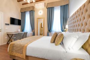 Posteľ alebo postele v izbe v ubytovaní Residenza La Duchessa Deluxe Rooms