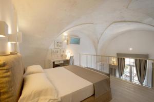 Ein Bett oder Betten in einem Zimmer der Unterkunft Baglioni Masseria Muzza Resort & Spa