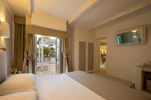 Ein Bett oder Betten in einem Zimmer der Unterkunft Baglioni Masseria Muzza Resort & Spa