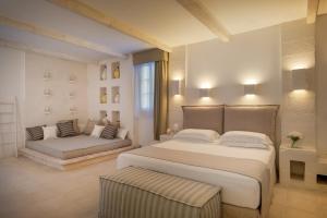 Ein Bett oder Betten in einem Zimmer der Unterkunft Baglioni Masseria Muzza Resort & Spa
