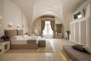 Ein Bett oder Betten in einem Zimmer der Unterkunft Baglioni Masseria Muzza Resort & Spa