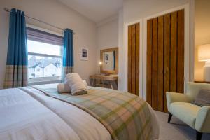 Un pat sau paturi într-o cameră la Howe Keld 4 First floor