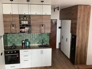 A kitchen or kitchenette at Babi Home