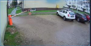 a white suv parked in a parking lot at Apartamenty Premium Loft in Wadowice