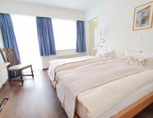 Postel nebo postele na pokoji v ubytování Hotel-Restaurant Grina