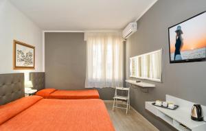 Telewizja i/lub zestaw kina domowego w obiekcie City Hotel