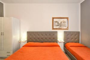 Łóżko lub łóżka w pokoju w obiekcie City Hotel