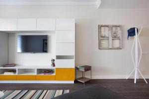 Televízia a/alebo spoločenská miestnosť v ubytovaní Consell de Cent Apartment