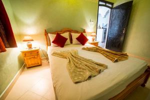 A bed or beds in a room at Original Surf Morocco