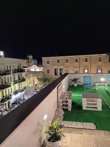 a view of a balcony at night at B&B VOLARE in Polignano a Mare