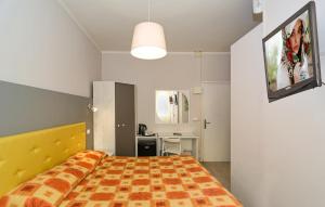 Łóżko lub łóżka w pokoju w obiekcie City Hotel