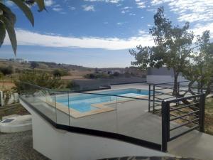 a view of a swimming pool from a house at Hall 92 Quartos com WC em moradia com piscina A-das-Lebres Loures in Loures