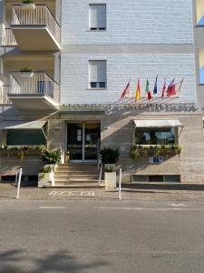 a building with flags on the front of it at Hotel La Meridiana in Sorrento