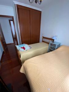 Postel nebo postele na pokoji v ubytování PISO EN PESCADOIRA (BUEU)