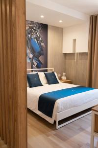 Postel nebo postele na pokoji v ubytování Antonio Busco rooms