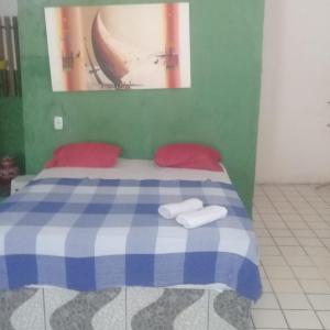 Ein Bett oder Betten in einem Zimmer der Unterkunft Pousada Só Alegria