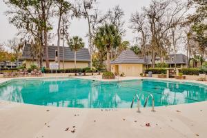 a swimming pool at a resort with blue water at Golfmaster D2 in Hilton Head Island