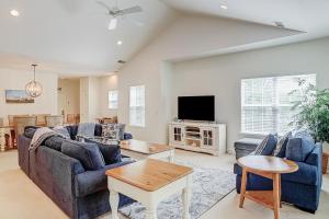 a living room with blue couches and a tv at Golfmaster D2 in Hilton Head Island