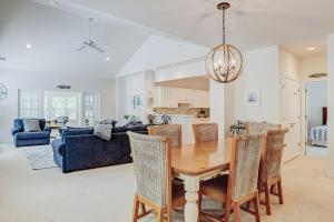 a dining room and living room with a wooden table at Golfmaster D2 in Hilton Head Island