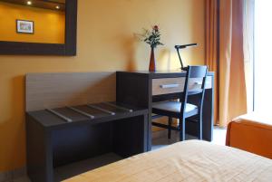 Postel nebo postele na pokoji v ubytování Hotel Michelangelo