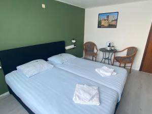 Postel nebo postele na pokoji v ubytování Hotel 't Sonnehuys