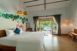 Кровать или кровати в номере Khu Nghỉ Dưỡng Green Bungalow Phu Quoc
