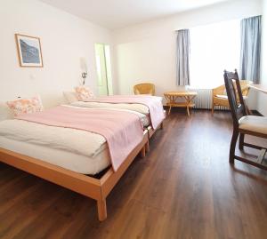Postel nebo postele na pokoji v ubytování Hotel-Restaurant Grina