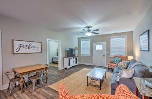 a living room with a couch and a table at Updated Apt 1 Mi to Western Kentucky University! in Bowling Green