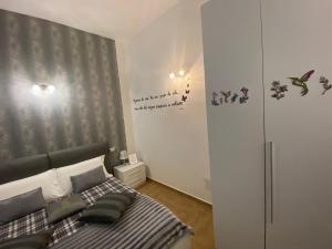 A bed or beds in a room at Residence Emozioni Ortigia