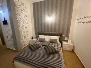 A bed or beds in a room at Residence Emozioni Ortigia