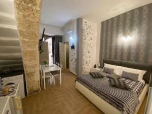 A bed or beds in a room at Residence Emozioni Ortigia