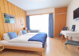 Postel nebo postele na pokoji v ubytování Hotel-Restaurant Grina