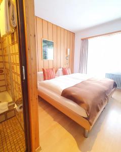 Postel nebo postele na pokoji v ubytování Hotel-Restaurant Grina