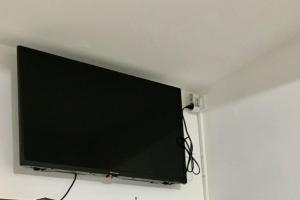 a flat screen tv hanging on a wall at studio cappella in Ajaccio