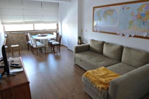 a living room with a couch and a table at Apartment with 2 bedrooms in Infantado in Loures in Loures