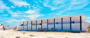 a building on the beach with bikes parked in front at Stabilimento Lido Burrone in Favignana