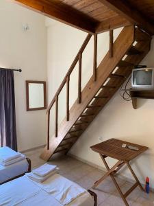 Postel nebo postele na pokoji v ubytování Despina Studios 4 beds with loft and kitchenette # 8