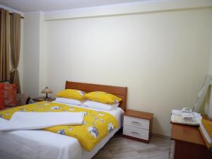 Holiday Center Apartment客房内的一张或多张床位