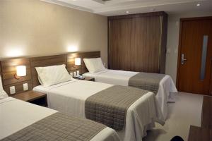 Postel nebo postele na pokoji v ubytování Pituba Praiamar Hotel + 35 fotografií