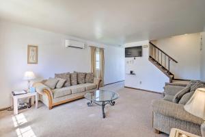 a living room with a couch and a glass table at Cozy Allentown Home, 2 Mi to Hamilton District! in Allentown