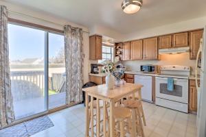 a kitchen with a table and a large window at Cozy Allentown Home, 2 Mi to Hamilton District! in Allentown