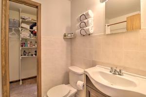 a bathroom with a toilet and a sink at Cozy Allentown Home, 2 Mi to Hamilton District! in Allentown +16 photos