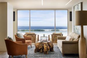 a living room with a view of the ocean at Monterey Tides in Monterey