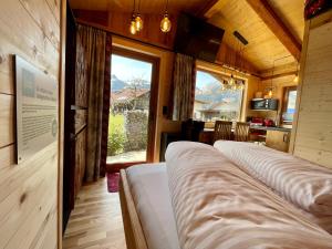 Ένα ή περισσότερα κρεβάτια σε δωμάτιο στο Tiny House Singer - contactless check-in - Sauna