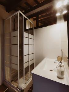 a bathroom with a sink and a shower at Casa Telégrafos in Jávea
