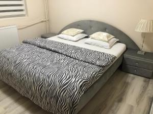 A bed or beds in a room at Boulevard Apartment