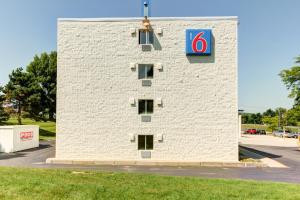 a large white building with a sign on the side of it at Motel 6-Portland, ME in Portland