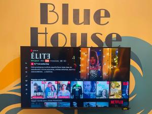 a blue house sign sitting on top of a table at Blue House Mallorca in Ses Salines