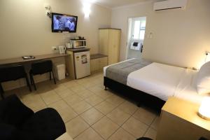 Kuchyň nebo kuchyňský kout v ubytování Tropic Coast Motel